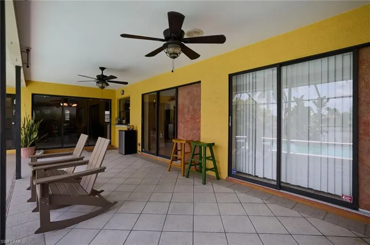View of patio featuring a ceiling fan and french doors