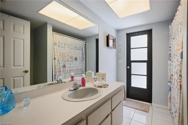Bathroom featuring vanity and tile patterned flooring