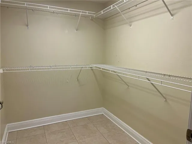 Walk in closet featuring tile patterned floors