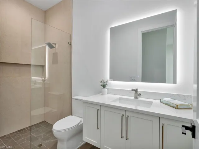 4th Bed/Guest Bedroom Floating Vanity with under-mount lighting and quartz countertop