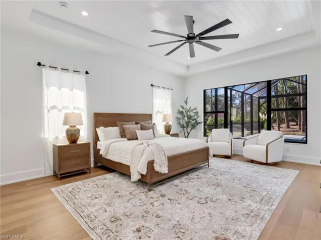 Primary Suite with Tray Ceiling & Walk-out to pool & patio, Safe Room/2 Walk-in Closets