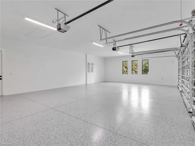 Oversized 3 Car Garage with Black/Grey Epoxy Flooring.