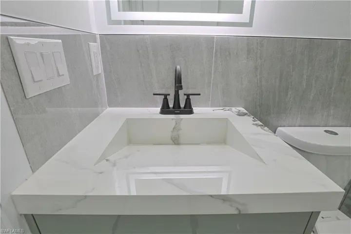 Bathroom with vanity and toilet
