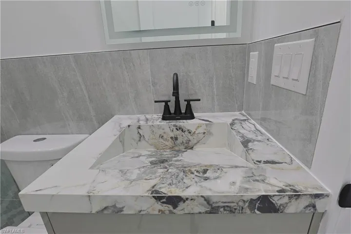 Bathroom view of vanity and toilet
