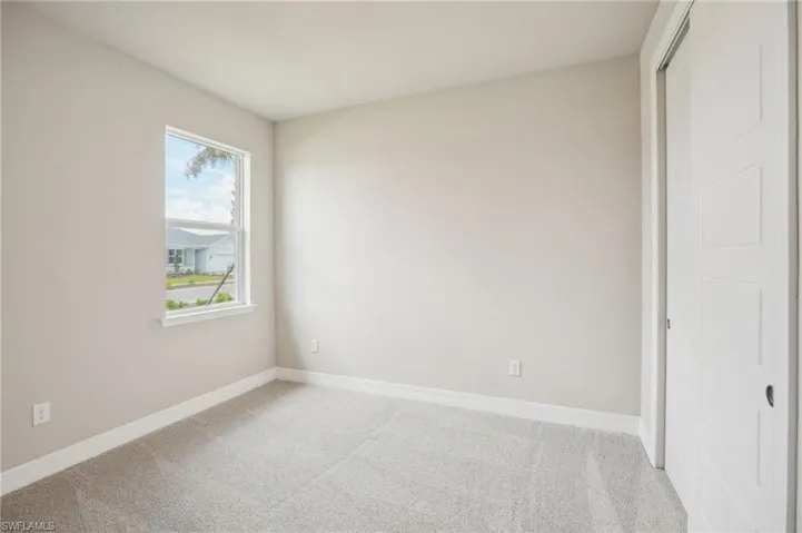 Unfurnished bedroom with carpet floors and a closet