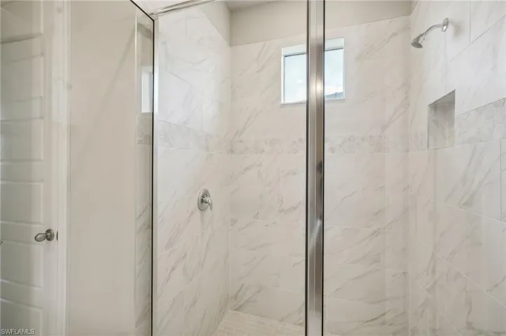 Bathroom with a shower with door