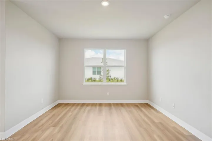 Unfurnished room with light hardwood / wood-style floors