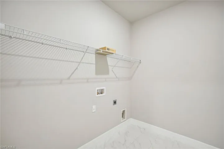 Clothes washing area with washer hookup and electric dryer hookup