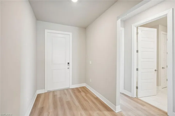 Corridor featuring light hardwood / wood-style flooring