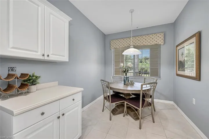 Dining room with baseboards and light tile patterned floors