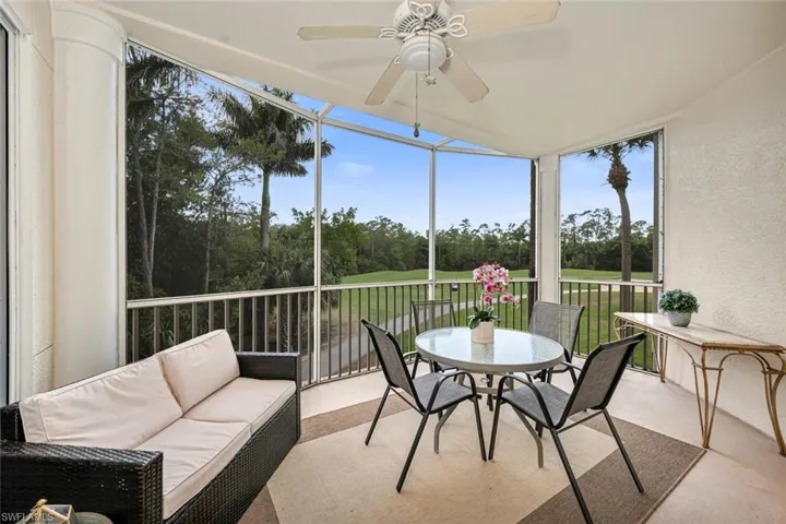 Sunroom / solarium with an outdoor living space and a ceiling fan
