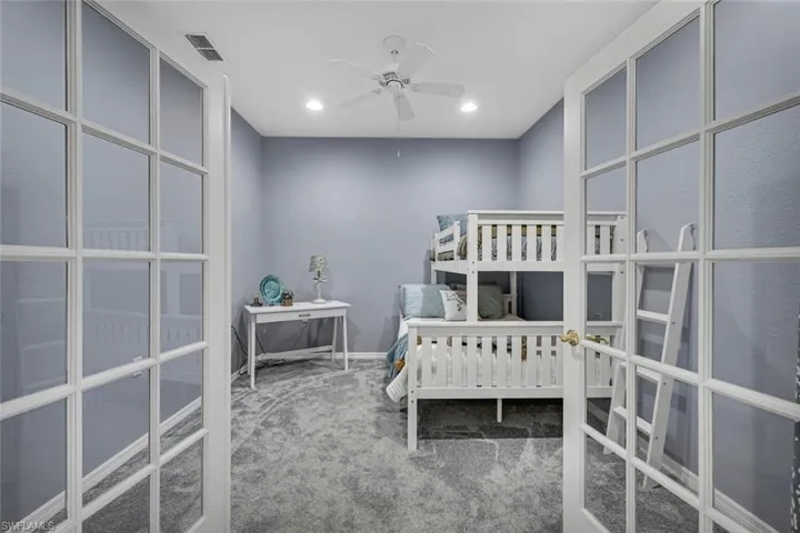 Bedroom with carpet flooring, french doors, baseboards, visible vents, and recessed lighting