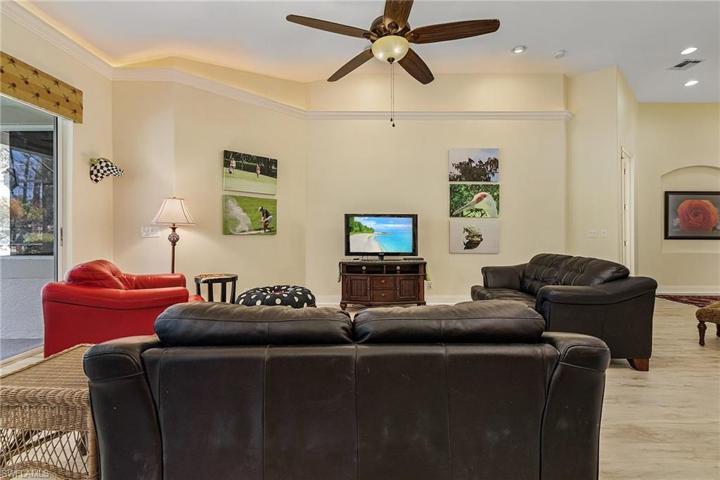 Kitchen has a breakfast bar, prep island, granite tops.