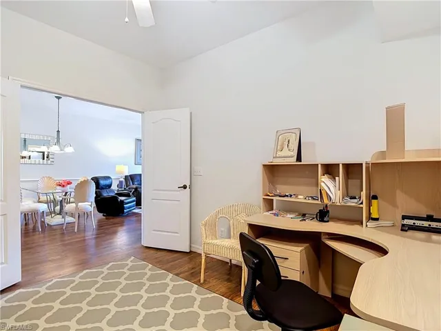 Spacious interior with wood-finish flooring and light-toned walls