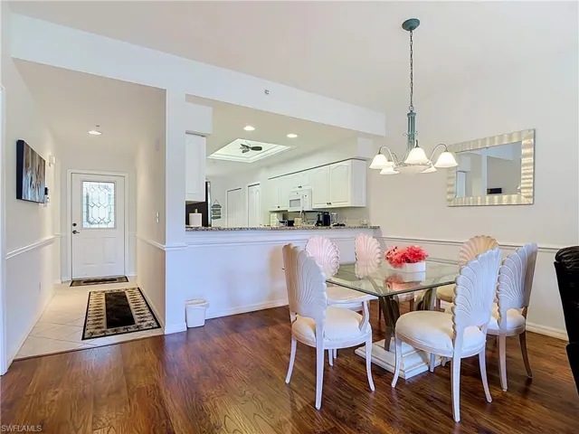 Wood-finish flooring with an adjacent tiled entry