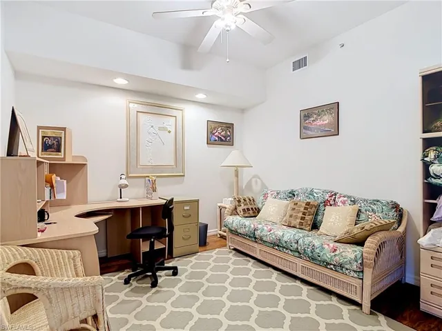 Vaulted ceiling with recessed lighting and ceiling fan