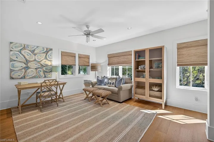 Den featuring ceiling fan, recessed lighting, and light wood-type flooring