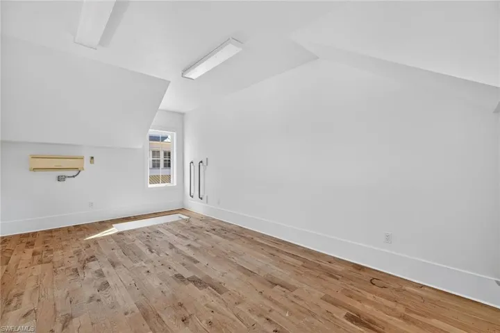 Bonus room/loft above garage featuring AC and light wood finished floors