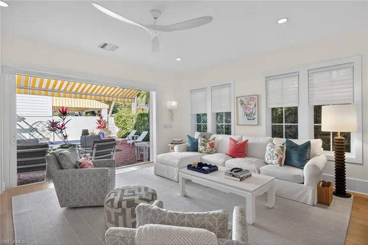 Living room featuring recessed lighting, light wood finished floors, and a ceiling fan