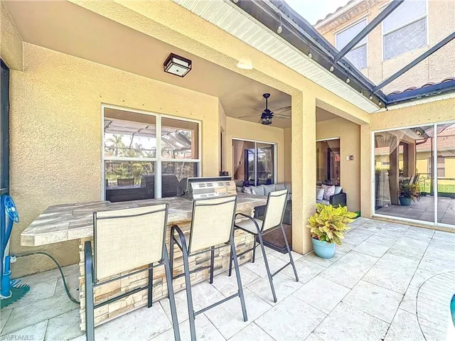 View of patio featuring ceiling fan