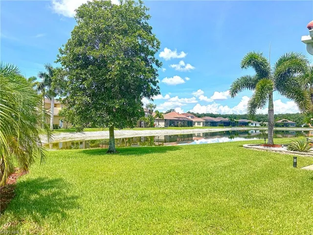 View of grassy yard featuring a water view