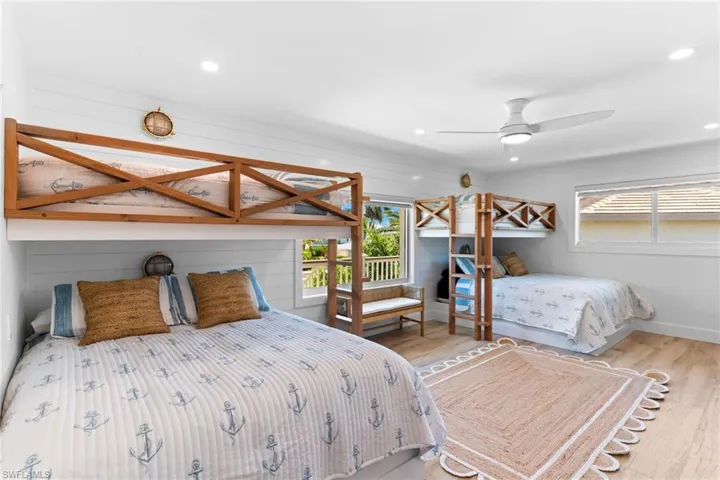 Bright room with wood-finish flooring and integrated bunk beds