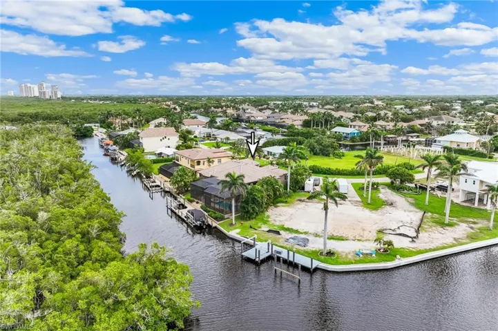 Aerial view of residential area with a large body of water