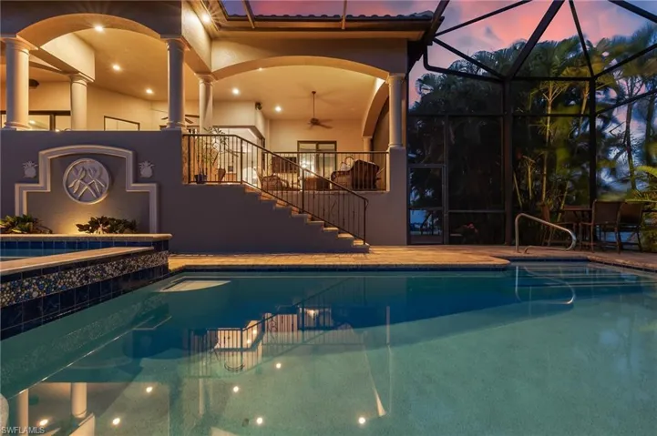 Outdoor pool featuring stairs, a patio area, a lanai, ceiling fan, and a sunroom