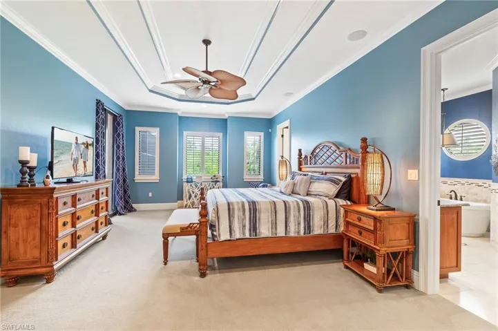 Bedroom with crown molding, light carpet, a ceiling fan, and recessed lighting