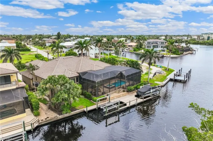 Aerial perspective of suburban area with a large body of water
