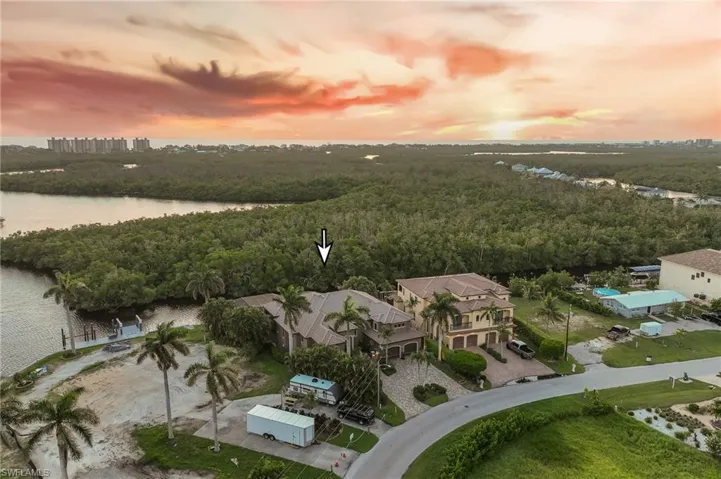 Aerial view at dusk of a water view and a forest view