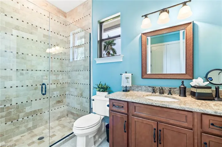 Full bathroom with a stall shower and vanity