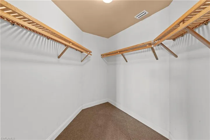 Walk in closet featuring carpet
