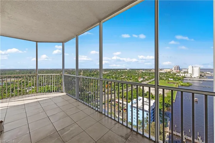 Unfurnished sunroom featuring a water view