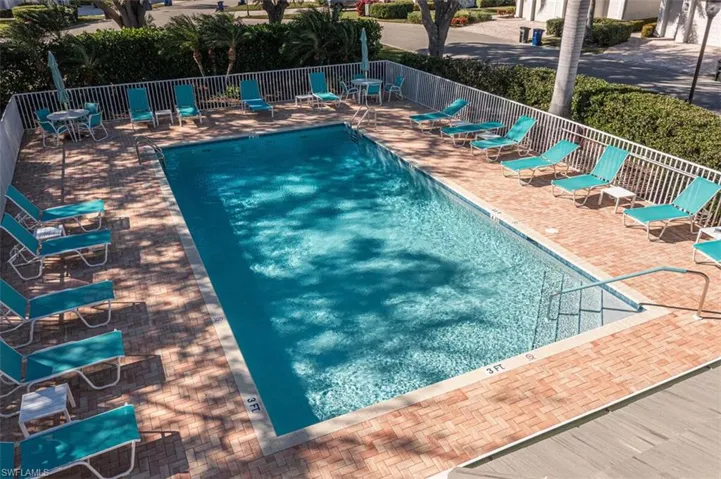 Community pool with a patio area
