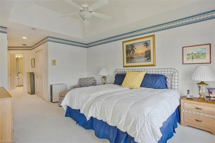 Bedroom with carpet, a closet, a ceiling fan, and recessed lighting
