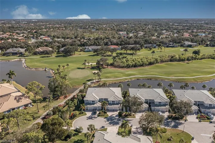 Aerial overview of property's location featuring nearby suburban area and a large body of water