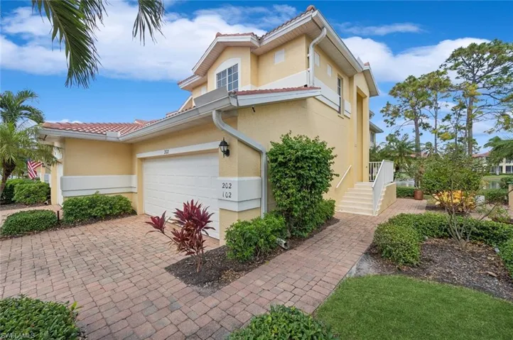 Ground floor side entry. No stairs- Private Entry door is behind entrance to upper Coach home