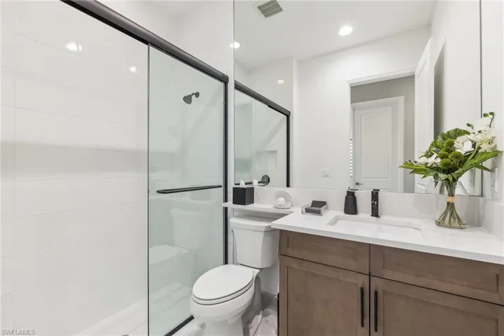 Guest bath with frameless shower