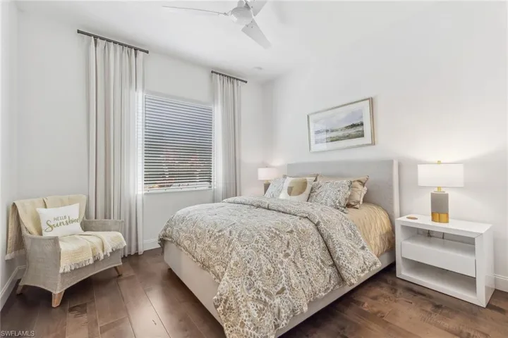 Guest bedroom with engineered hardwood flooring