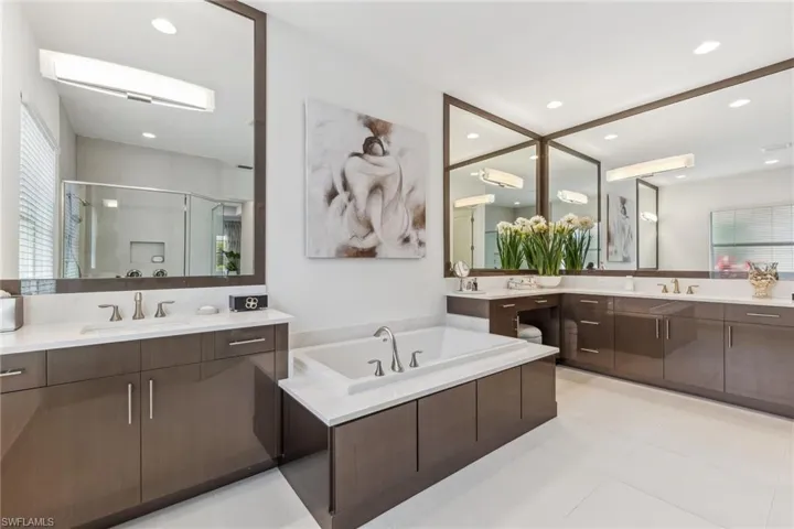 Elegant primary bathroom with polished porcelain flooring