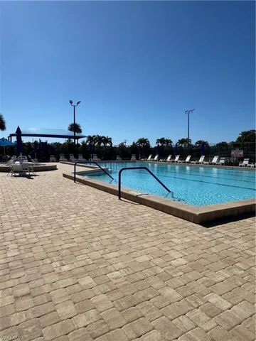 Community pool featuring a patio area