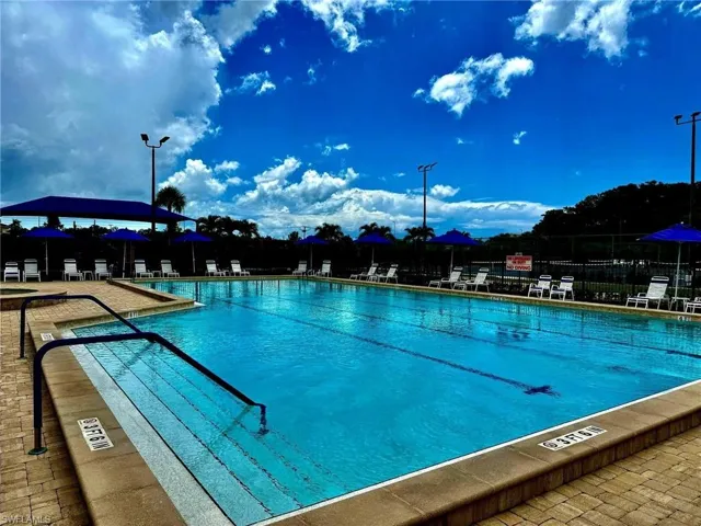 Community pool featuring a patio area
