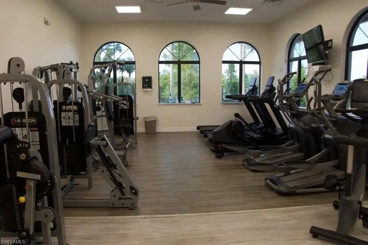 Exercise room with a ceiling fan