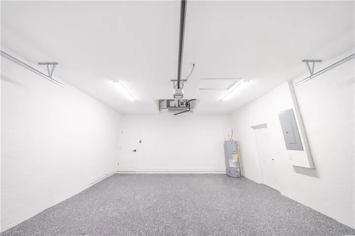 Garage with electric panel and water heater