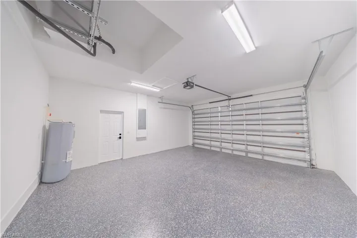 Garage with water heater and electric panel