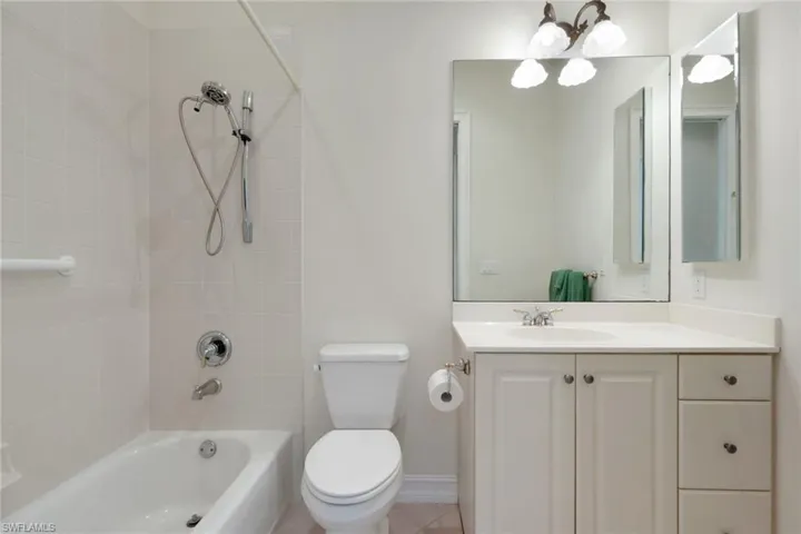 Bathroom with vanity and  shower combination