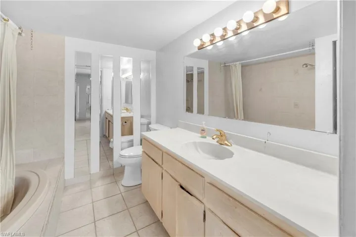 Full bathroom featuring  tile floors, and shower / tub combo