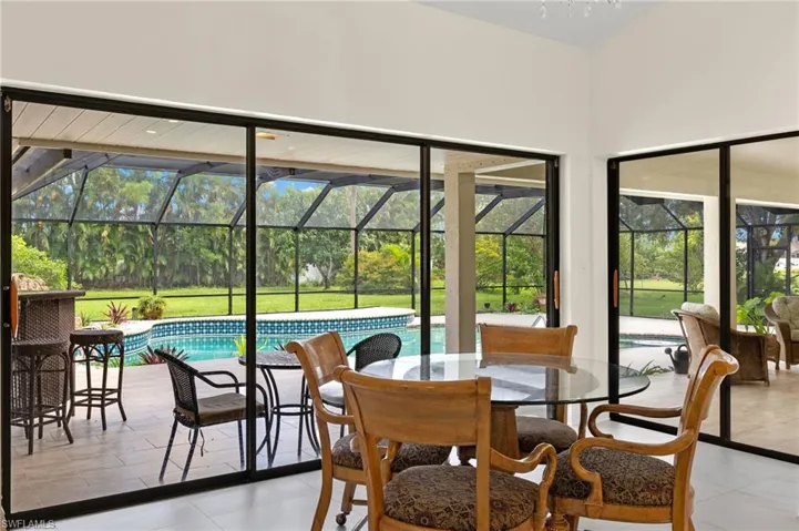 Sunroom / solarium with outdoor dining space