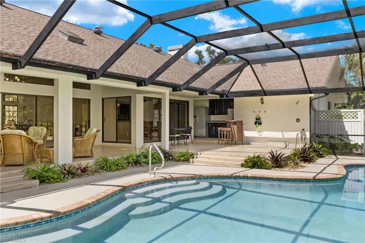Pool with a patio and a lanai